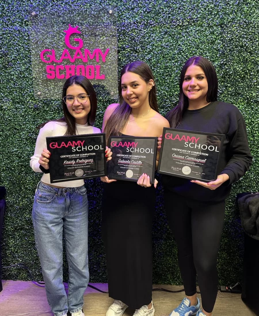 Three Glaamy trainees holding their certificates